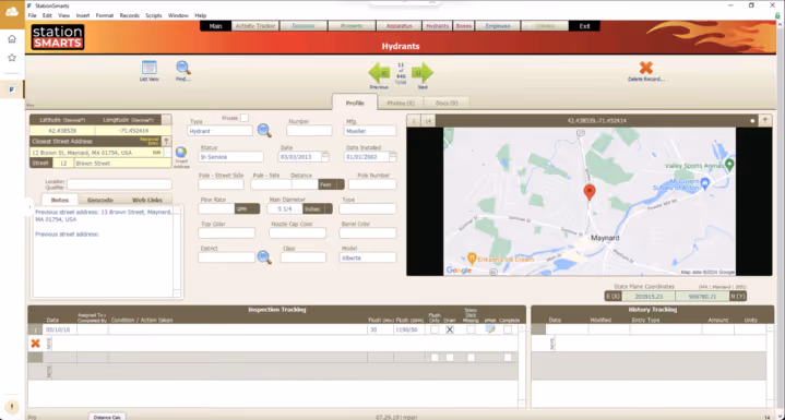 Computer screen showing Station Smarts hydrant management software with a map pinpointing a hydrant location in Maynard, MA and detailed hydrant data fields.